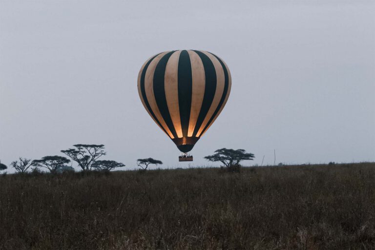 Hot-air balloon over the Serengeti plains at sunrise